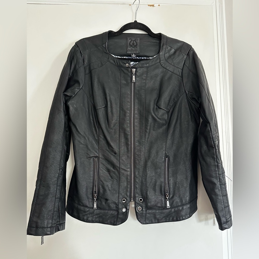 Odyn Women’s Black Vegan Leather Moto Jacket. Quilted sides Metal Accents.